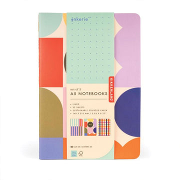 Set of three A5 notebooks with colorful geometric design on packaging