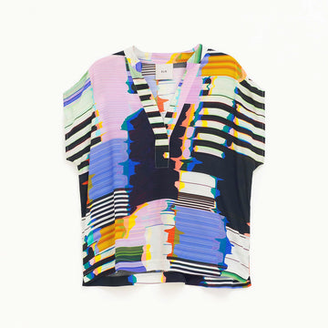 A shirt sleeve top with a V neckline and a multicoloured print.