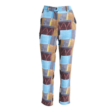 Front view of a pair of women's pants printed with an abstract print in blue, orange and burgundy.