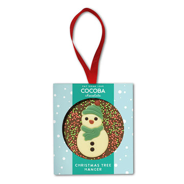 Chocolate Christmas tree hanger with a snowman design on a light blue background.