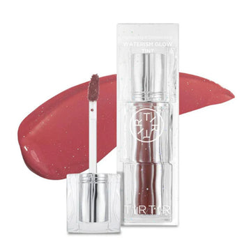 Lip gloss with applicator and packaging on a white background.
