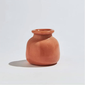 A short round vase in the shape of a jar with a smaller opening in an orange clay colour.