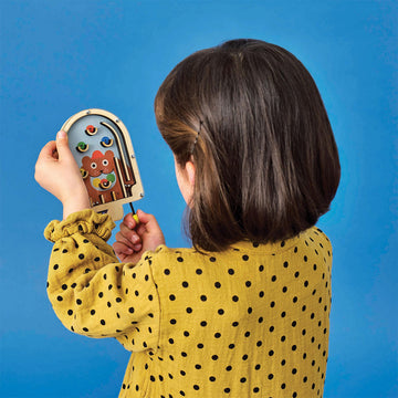Three wooden pinball games each with a different animal in the background including a frog and a snake.