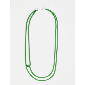 A mesh chain necklace in green with a double strand and a twist overlapping the strands.
