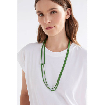 A mesh chain necklace in green with a double strand and a twist overlapping the strands.