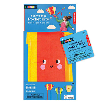 A folded up kite in yellow and red with a face in a packet with the heading 'Funny Faces Pocket Kite'.