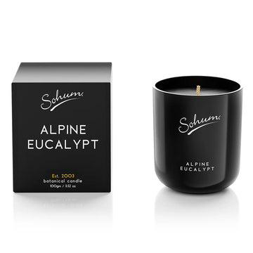A black glass candle next to a matching black cube box with the text 'Alpine Eucalypt' on the front.