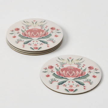 A set of four round coasters illustrated with a red waratah flower.