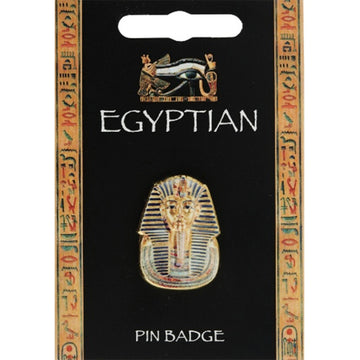 A pin badge shaped like King Tutankhamum's mask on a black card with a hieroglyphics border.