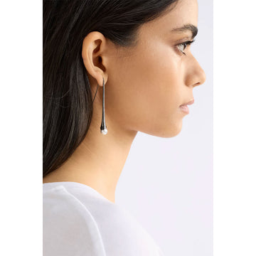 Pair of silver drop earrings on a white background.