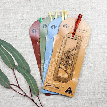 Set of colorful bookmark cards with wooden bookmarks attached.