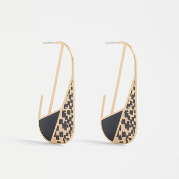 A pair of open oval shaped hoop earrings with black details on the bottom half.