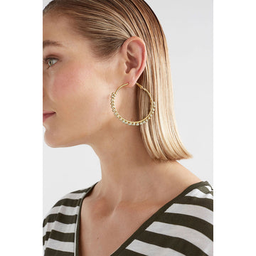 A pair of gold hoop earrings with mulberry pink purple beads around the edges.