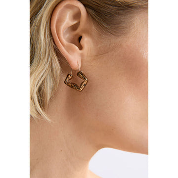 Pair of green square hoop earrings with blue speckles on a white background.