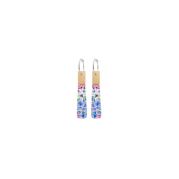 A pair of hoop earrings with a long tab shape printed with floral artwork and a gold rectangle at the top.