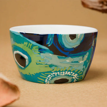 A ceramic bowl printed with artwork by May Wokka.