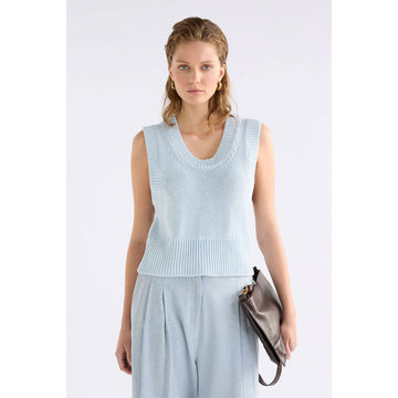 Light blue knitted vest on a white background.