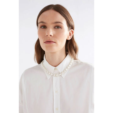 A gold chunky chain necklace with spiky links in between.