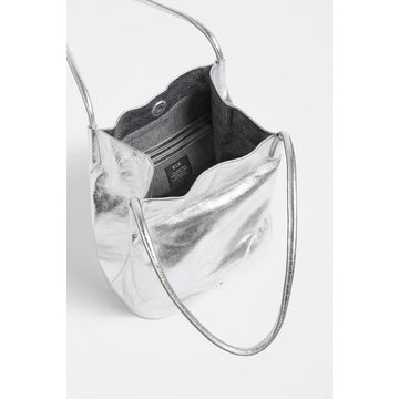 Silver metallic handbag on a light gray background.