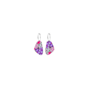 A pair of hoop earrings with a triangular shape attached printed with purple floral artwork.