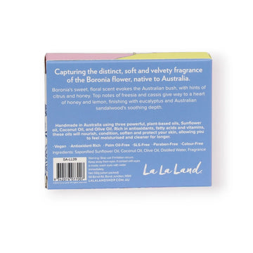 A wrapped up bar of soap with the heading 'Natural Soap Pieces of Poetry' with an illustration of a koala and flowers. There is an unwrapped bar of soap underneath.