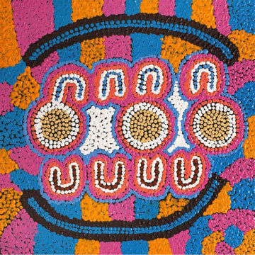 A square painting with a pink, orange and blue background with circles and arches painted in the middle.