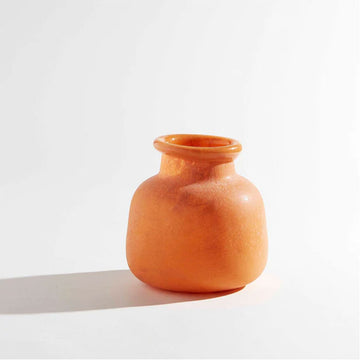 A short round vase in the shape of a jar with a smaller opening in an orange colour.