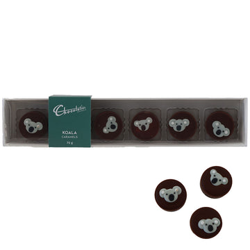A set of six round caramels decorated with a koala head inside clear packaging.