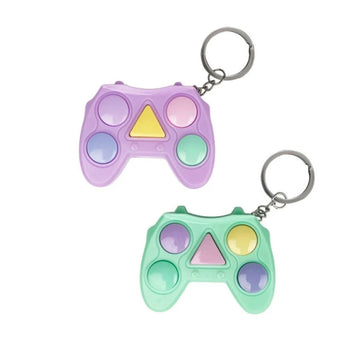 A game in the shape of a controller with coloured buttons is in clear packaging attached to a blue card backing.