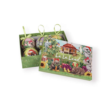 Set of Christmas ornaments with a 'La La Land' box in the center on a white background. The baubles and box are illustrated with Australian animals.