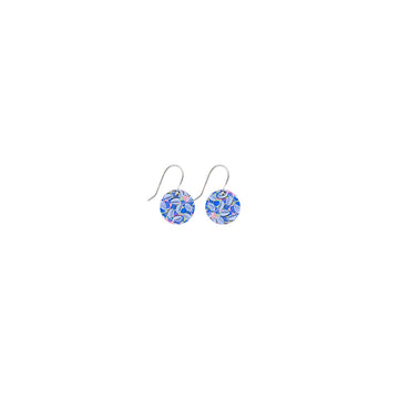 A pair of drop earrings with a small circle printed with blue floral artwork.
