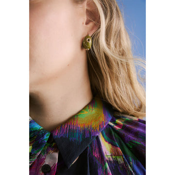 Pair of green hoop earrings with gold accents on a white background.