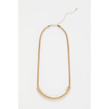 A gold necklace with a round chain and a long gold covering.