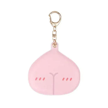 Pink emoji-shaped keychain with a gold clasp on a white background.