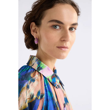 Pair of pink hoop earrings with gold accents on a white background