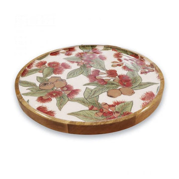 Round wooden tray with floral design on a white background.
