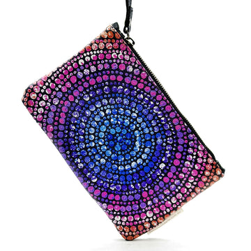 A printed leather clutch bag with a zip along the top and a wrist strap attached to the zip. The front is printed with artwork by Olivia Wilson.