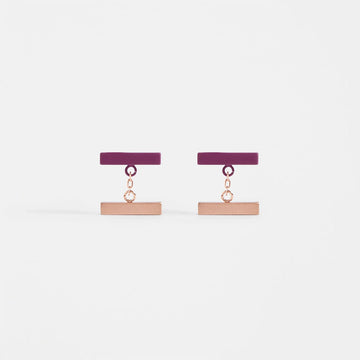 A pair of drop earrings featuring a mulberry coloured horizontal bar linked to a gold horizontal bar.