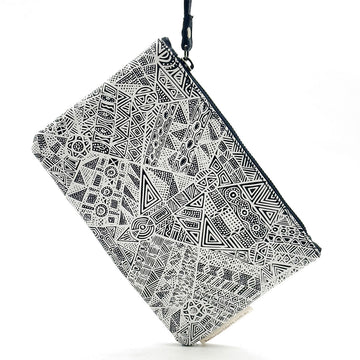 A leather clutch bag with a zip along the top and a wrist strap attached to the zip. The front is printed with artwork by Simplicia Tipungwuti.