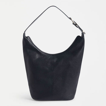 Black leather handbag on a light gray background.