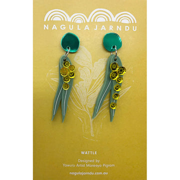 A pair of drop earrings in green with wattle and leaves hanging off a green circle attached to a yellow product card.