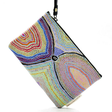 A leather clutch bag with a zip along the top and a wrist strap attached to the zip. The front is printed with artwork by Liddy Walker.