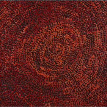 A square painting with a circular design made up of red and orange dots on a black background.