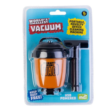 A tiny vacuum cleaner packaged up in clear packaging attached to a blue information card.