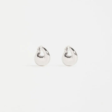 A pair of chunky silver hoop earrings.
