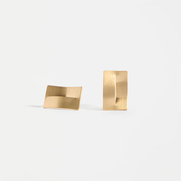 Two gold rectangle stud earrings on a white background.