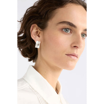 Two gold rectangle stud earrings on a white background.