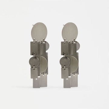Pair of silver earrings on a white background.