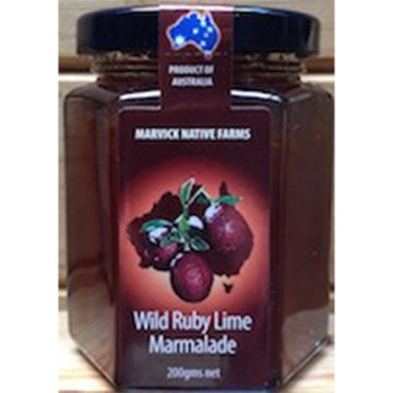 A hexagon shaped jar with a product label on the front with the text 'Wild Ruby Lime Marmalade'.
