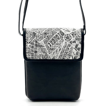 Front view of a black leather sling bag printed with artwork by Simplicia Tipungwuti on the flap.